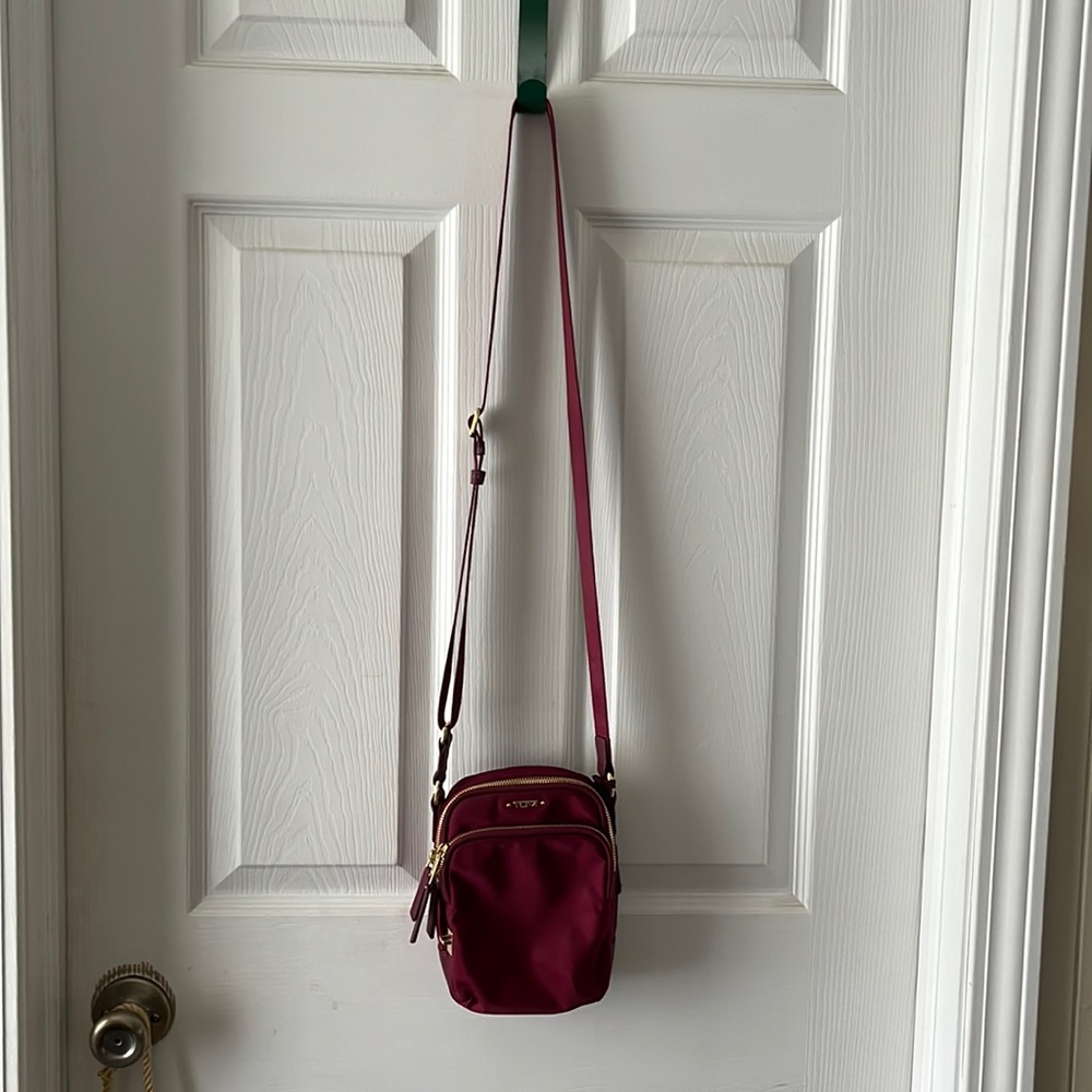 Red Tumi small purse In excellent condition